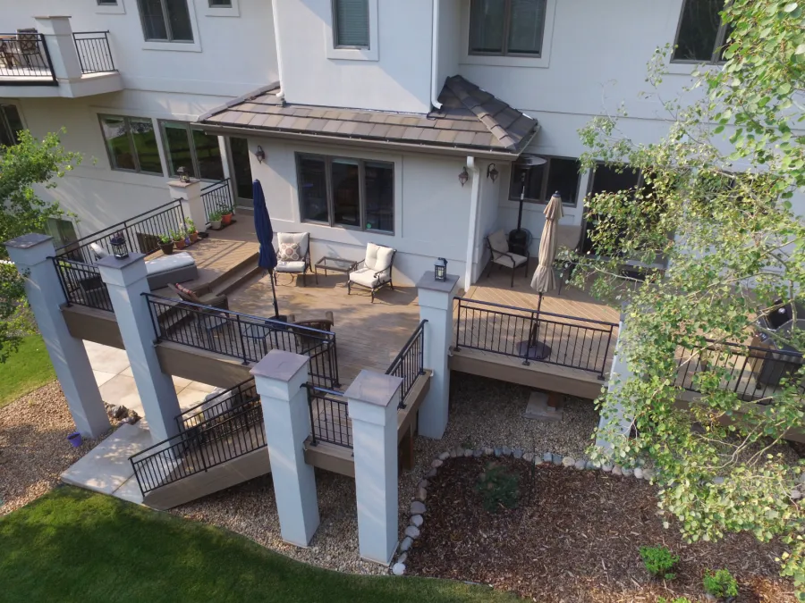 Custom Decks Timbertech dark roast deck two levels stucco columns custom wrough iron railing littleton colorado