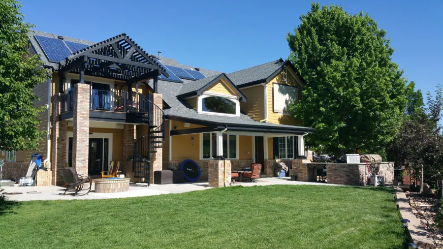 Custom Decks Trex deck black fascia brick columns spiral staircase aurora colorado