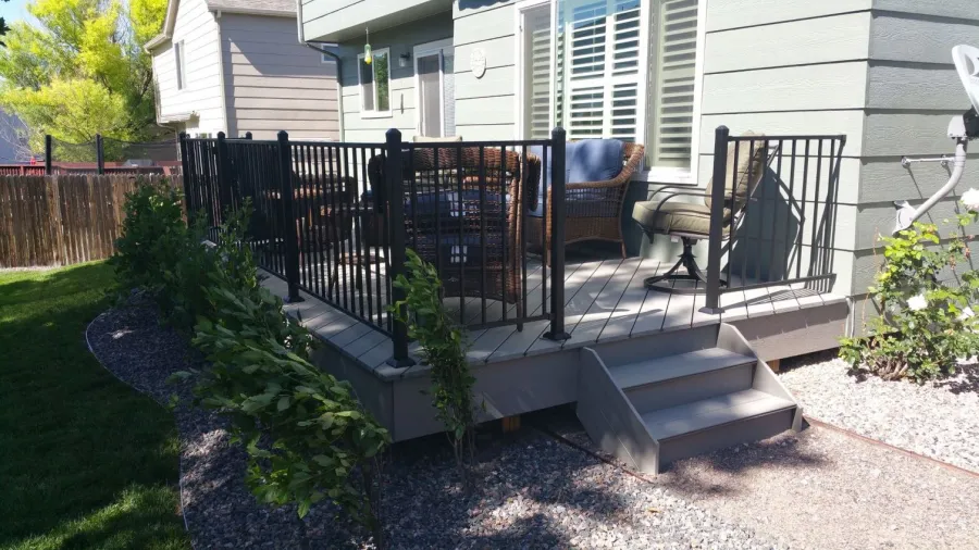 Custom Decks ground level deck trex decking gravel path black fortress railing aurora colorado