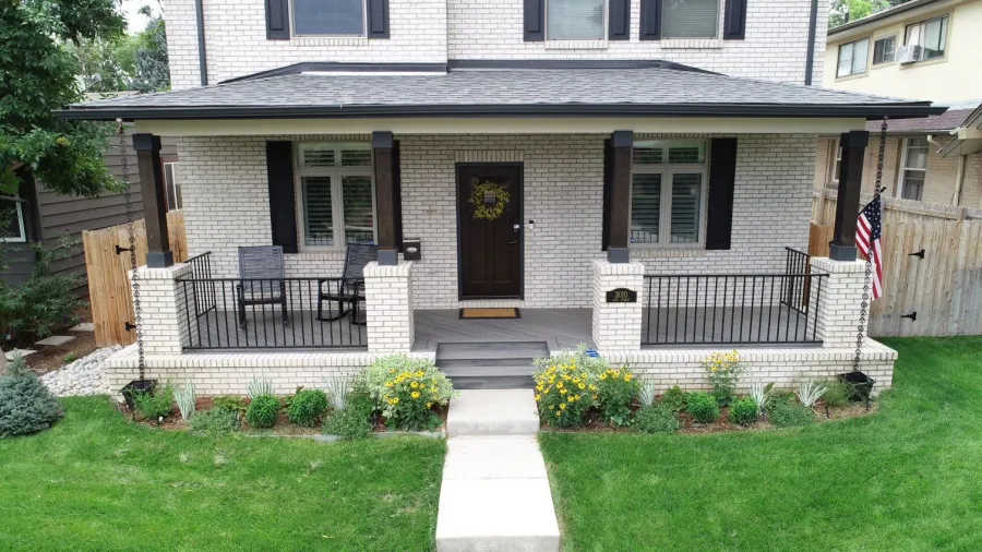 Custom Decks trex island mist decking fortress iron panel railing wrapped posts in brick dark wood finish denver colorado