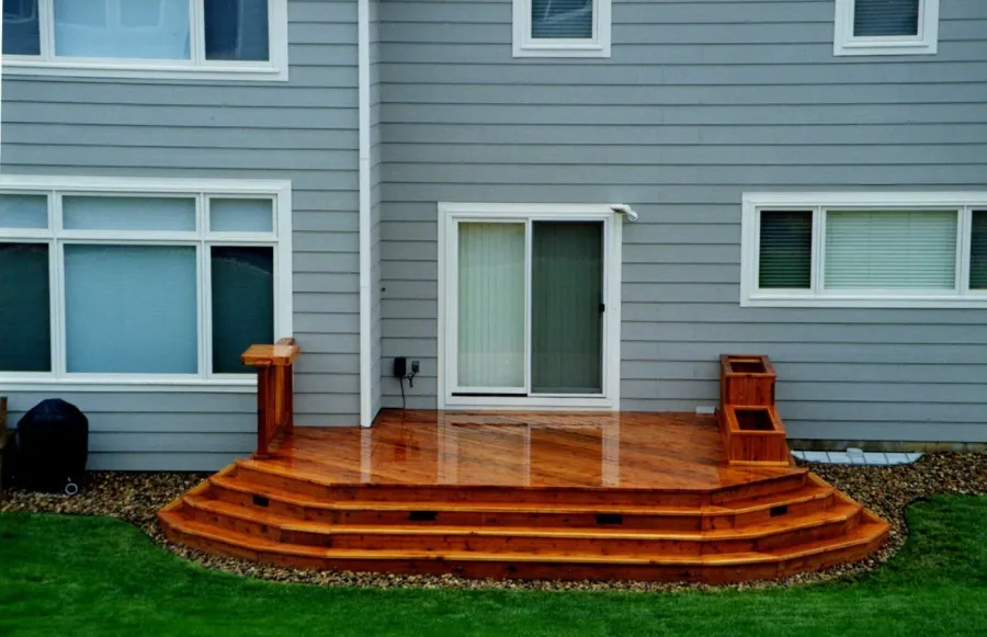 Custom Decks ground level redwood deck planters wrap around stairs parker colorado