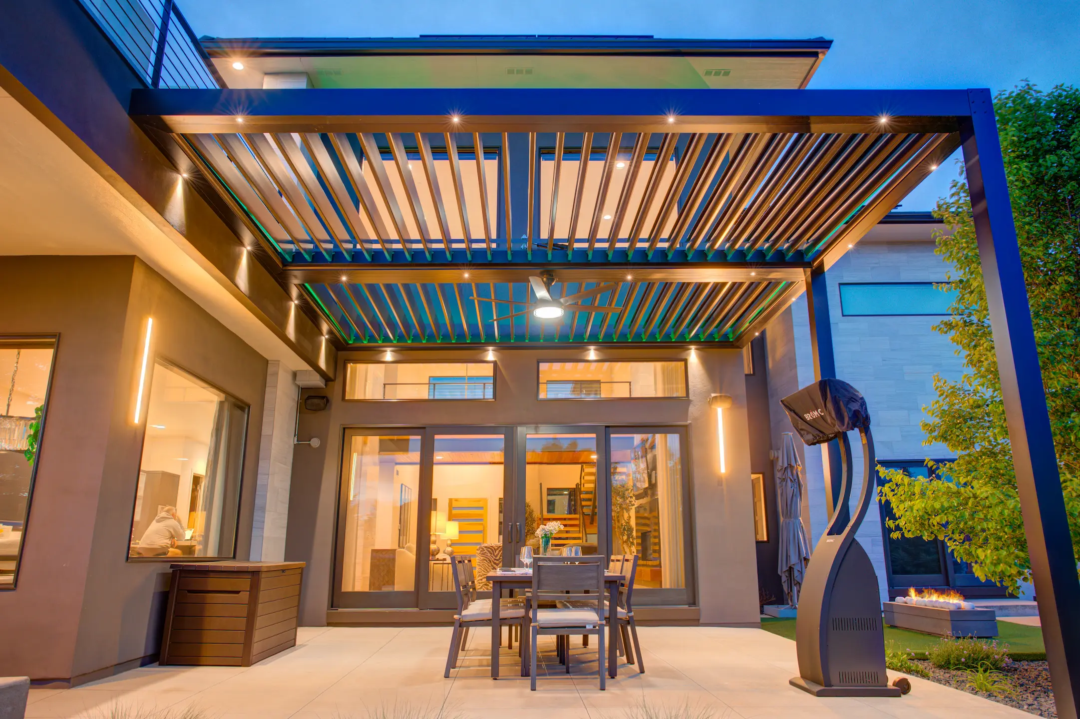 Attached pergola with custom lighting